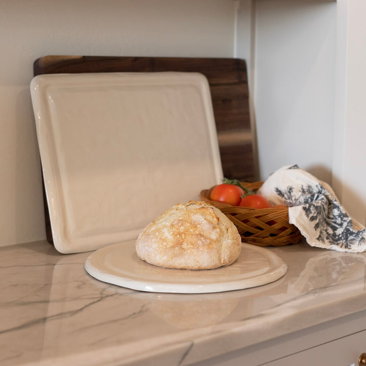 Sourdough bread on a ceramic kitchen board.